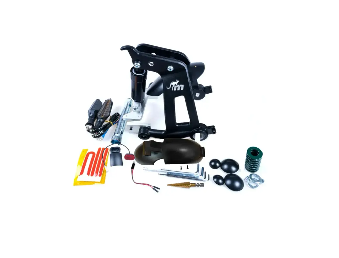 Ensemble de pièces détachées pour Kuickwheel S1-C Pro : support, amortisseur, clignotants, et outils.