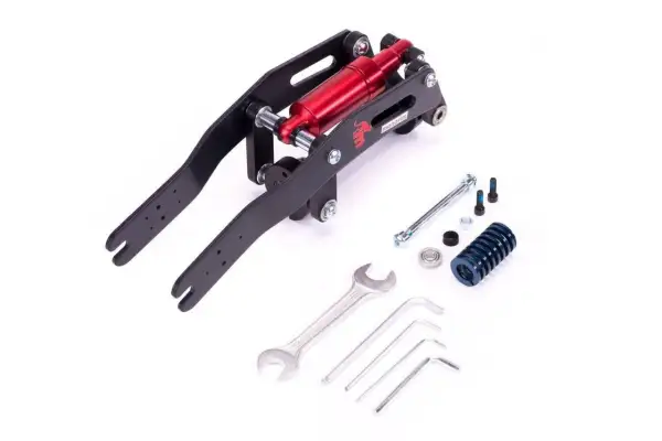 Un système de suspension monorim noir et rouge avec des outils.